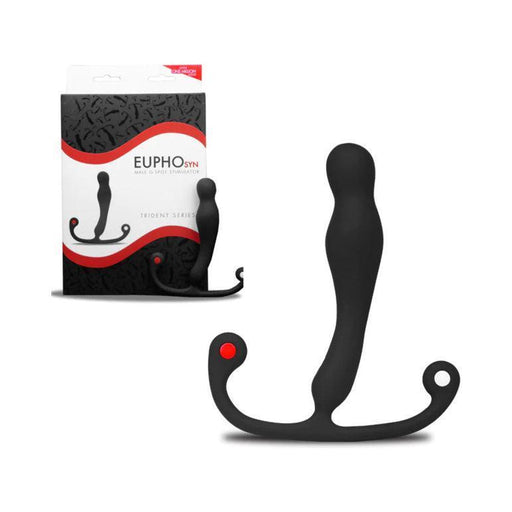 The Aneros Eupho Syn Trident Hands-Free Silicone Prostate Stimulator, a black device with a curved design and flared handles, made of medical-grade silicone, is shown in front of its packaging. The packaging features the brand name "Aneros" and an image of the massager. The toy has a smooth texture with a red dot on one of the handles for enhanced prostate stimulation.