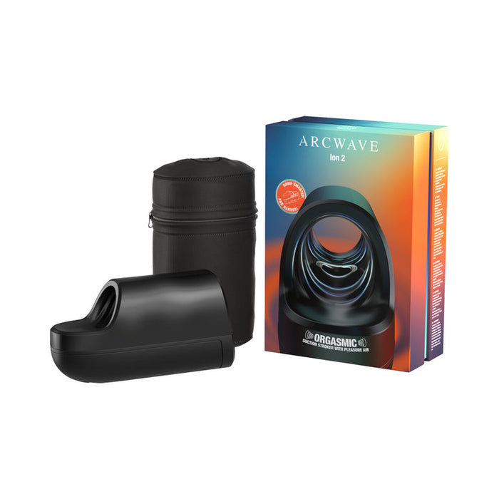 The Arcwave Ion 2 Penis Masturbator with Pleasure Air Suction is shown in black silicone next to a zippered case and a colorful box, highlighting its advanced suction technology for enhanced pleasure.