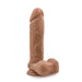 The Au Naturel 9.5 Inch Dual Density Suction Cup Dildo - Mocha by Blush is a body-safe, realistic-looking dildo with a strong suction cup base and detailed texture that mimics a human penis. The dildo is flesh-toned with veins and a pronounced head, and it stands upright.
