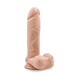 The Au Naturel 9.5 Inch Dual Density Suction Cup Dildo by Blush is a realistic toy with a vanilla hue, designed with a suction cup base and intricate detailing, including a pronounced head and veined shaft. This phthalate-free dildo also features lifelike testicles, all meticulously crafted to replicate the appearance of a human penis.