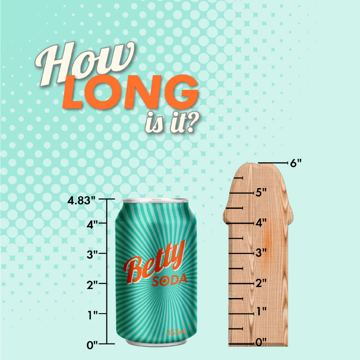 A green Betty Soda can (4.83" tall) stands beside a wooden object with inch marks up to 6", resembling the b-Vibe Slipskin Realistic 6 Inch Girthy Dark Tone Silicone Dildo. Above, text on a blue and white dotted background asks, "How LONG is it?.