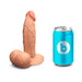 A b-Vibe Slipskin Realistic 6 Inch Girthy Silicone Dildo in Caramel and a can of soda.