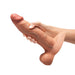 A hand holding the b-Vibe Slipskin Realistic 9 Inch Girthy Silicone Dildo in Caramel, designed for lifelike sensations and compatible with strap-on harnesses.