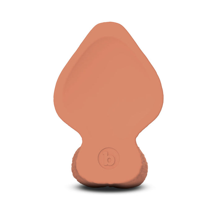The b-Vibe Slipskin Ultra Realistic Girthy 9 Inch Medium Tone Silicone Dildo features a lifelike caramel color, broad flat base with an embossed "b" logo, and a tapered tip. Made from realistic silicone for an authentic look and feel.