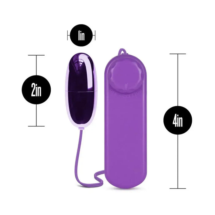 Introducing the Blush B Yours First Time Wired Remote Control Power Bullet Vibrator in a sleek purple hue. This egg-shaped, multispeed device stands 2 inches tall and 1 inch wide. It features a cord connecting to a rectangular remote control measuring 4 inches in height. Both items are displayed against a crisp white background, ideal for clitoral stimulation.