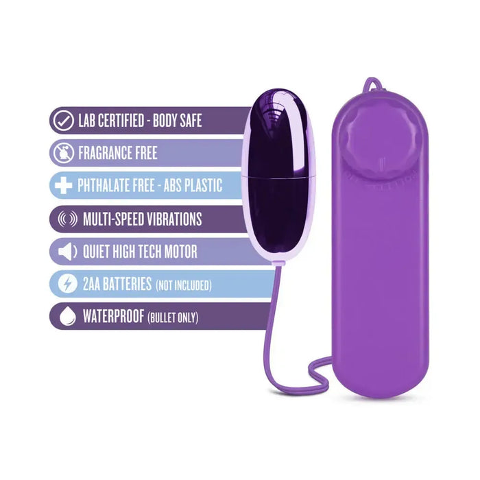 The B Yours First Time Wired Remote Control Power Bullet Vibrator by Blush is an egg-shaped, purple vibrator connected by a cord to a matching remote control. The image highlights features through icons and text: lab certified, body safe, fragrance-free, phthalate-free, multispeed bullet vibrations for clitoral stimulation, quiet high-tech motor, requires 2 AA batteries (not included), and waterproof (bullet only).