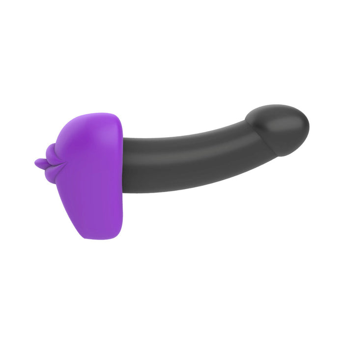 The Bananapants Kissi Dildo Base with Lips and Tongue is a black and purple silicone sex toy, penis-shaped with a textured base for extra stimulation, body-safe, strap-on harness compatible, shown against a white background.