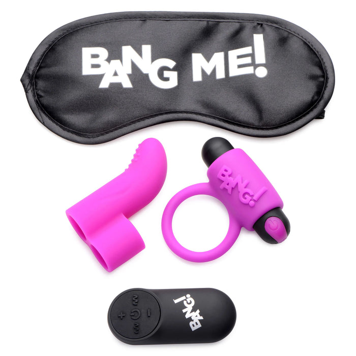 The BANG! Couple's Cock Ring, Finger Vibe, Bullet & Blindfold Kit in Purple by XR Brands includes a blindfold with "BANG ME!" printed on it, a purple vibrating bullet attachment, a silicone love ring with "BANG!" written on it, and a black remote control featuring buttons for device control.