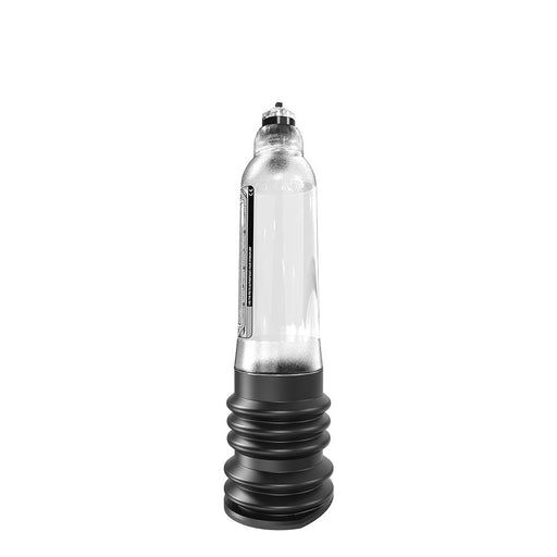 An image of the Bathmate Hydro 7 Penis Pump - Clear, featuring a transparent plastic body with a metallic cap and a ribbed base. The product stands empty and upright on a plain white background, showcasing its sleek design.