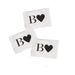 Three small white packets from the Beloved Vacation Lovin' Intimacy Kit, each featuring a bold black "B" and heart symbol on the front, are arranged on a white background—perfect for your sensual travel essentials.