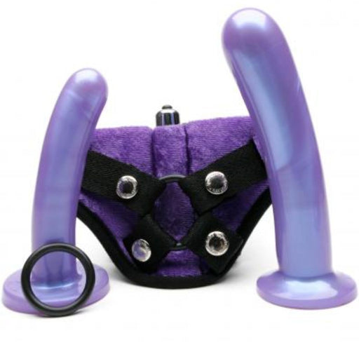 An adjustable harness with two Tantus purple Bend Over Intermediate dildos and an o-ring displayed on a white background.