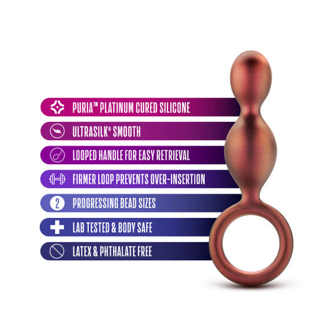 Product showcase of Blush's Matrix First Time Soft Silicone Duo Anal Beads with Finger Loop, featuring a smooth ultra-silk finish, safety retrieval loop, and highlighting its material qualities—latex and phthalate free, lab tested, body-safe—for