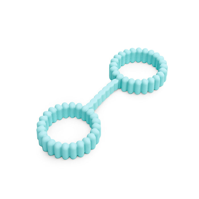 The Biind Flexible Silicone Beginner Cuffs are light blue, double-ringed cuffs made from body safe silicone with textured, ridged surfaces, joined by a short straight bar and shown on a white background.