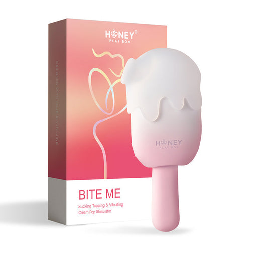 A pink and white ice cream-shaped clitoral vibrator stands before its colorful box, displaying abstract line art and the text "Honey Play Box" and "Bite Me Sucking Tapping & Vibrating Cream Pop Vibe.