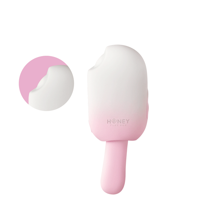 The Bite Me Sucking Tapping & Vibrating Cream Pop Vibe is a pink and white handheld clitoral vibrator with a rounded top and small circular opening. An inset shows a close-up of the opening, all set against a white background.