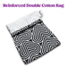 The Blush Bomba Black & White Hearts Sex Toy Storage Bag by Blush is a black and white patterned bag with a folded white top and a label on the side. Featuring heart-shaped geometric patterns and machine washability, the text above the bag reads "Reinforced Double Cotton Bag" in purple.