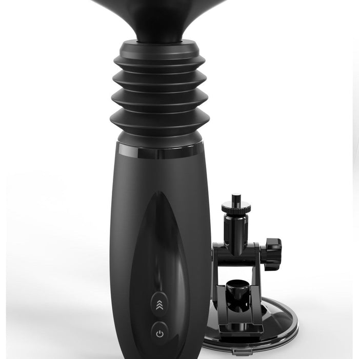 A sleek, black coffee grinder with a cylindrical body and an accordion-style middle section. It features two buttons on its front and comes with a detachable Body Dock Thruster Powerful Thrusting Suction Cup Sex Toy Mount by Pipedream Products, also black, positioned to the right of the grinder. The background is white.