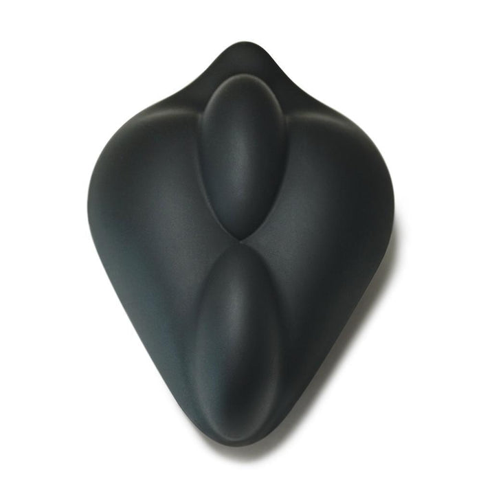 The Bumpher Textured Dildo Base for Harness Play by Bananapants is a smooth, black, sculptural object with an organic, abstract shape resembling a rounded, symmetrical heart. Its matte surface features a double-bump design at its center. Artistic and modern in appearance, it could easily be mistaken for an innovative silicone sleeve.