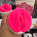 Clone-A-Pussy Plus+ Silicone Vulva Casting Kit Hot Pink held in a person's hand, view of the entrance
