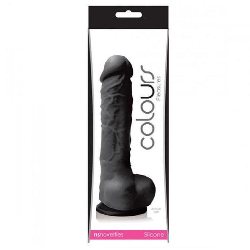 A Colours Realistic 7 Inch Silicone Suction Cup Dildo - Black is packaged in a rectangular box with a clear plastic front. Branded as "Colours Realistic 7 Inch Silicone Suction Cup Dildo - Black" by NS Novelties, this dildo is showcased upright with a suction base. The packaging features white and black design elements along with product details.