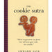Image of a book cover titled "Cookie Sutra: An Ancient Treatise: that Love Shall Never Grow Stale. Nor Crumble" by Workman Publishing, featuring two gingerbread cookies in a playful embrace, with a quote and author’s name, Edward Jaye, at the bottom.