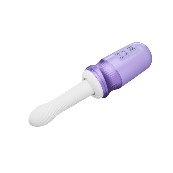 The Violet Vixen Warming Thrusting Vibrator with Suction Mount, featuring white and purple liquid silicone, control buttons, and a display screen on the handle, is displayed against a plain white background.