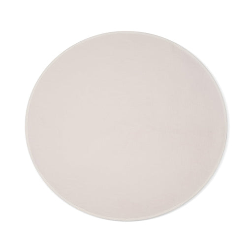 The Dame Thro Soft Waterproof Sex Blanket, shown from above on a white background, features a round shape in light beige with a subtle textured surface. Made of ultra-soft, machine-washable cotton for easy care.