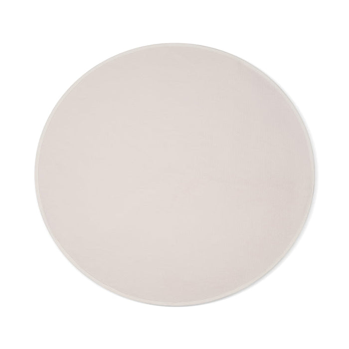 The Dame Thro Soft Waterproof Sex Blanket, shown from above on a white background, features a round shape in light beige with a subtle textured surface. Made of ultra-soft, machine-washable cotton for easy care.