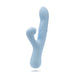 The Devin Clit Thumping G-Spot Rabbit with Shaft Rotation by Blush is a light blue silicone dual-stimulation vibrator featuring a smooth, curved design. It has one main shaft with a slightly rounded tip and textured ridges for ideal G-spot vibrations, plus a smaller arm for external stimulation. The base includes control buttons to adjust various settings.