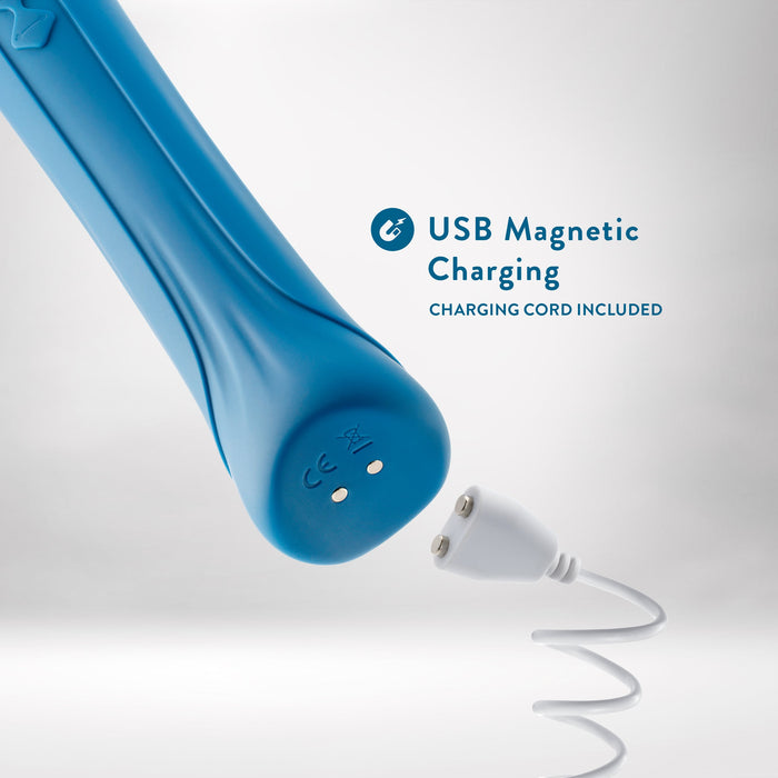 Introducing the Blush Dianna Rechargeable Rumbly Waterproof Wand Vibrator, a luxurious blue device featuring two metallic charging points and accompanied by a white magnetic USB charging cord. Text on the packaging reads "USB Magnetic Charging" and "CHARGING CORD INCLUDED." Enjoy 20 distinct vibrating patterns and complete waterproof functionality against a backdrop with a clean, light gradient.