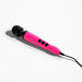 The Doxy Die Cast 3 Compact Wand Vibrator in Hot Pink is a handheld massager featuring a black head and black control buttons, made from body-safe silicone. Equipped with a power cord and elegantly resting on a white surface, this compact powerhouse delivers targeted intensity.