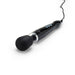 A black Doxy Die Cast Extra Powerful Wand Vibrator is shown. This luxurious handheld massager, with a spherical head and an attached power cord, features a sleek ergonomic design with control buttons on its body. It delivers deep rumbly vibrations for optimal relaxation, making it a top choice from the renowned brand, Doxy.