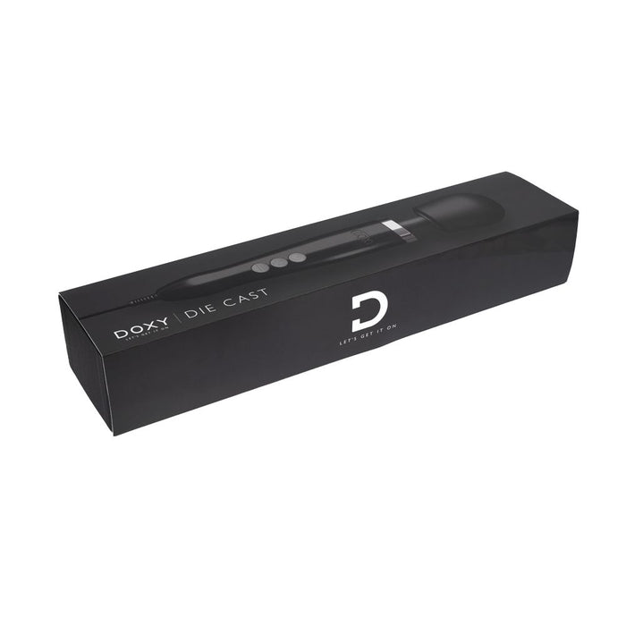 A black box showcasing the luxurious Doxy Die Cast Extra Powerful Wand Vibrator - Black. The elegant design features an image of the wand on the front, with "Doxy" and "Die Cast" prominently printed. The slogan "Let’s Get It On" and a large "D" emphasize its deep rumbly vibrations.