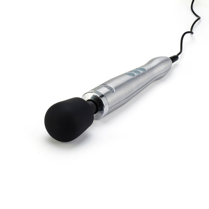 A Doxy Die Cast Extra Powerful Wand Vibrator - Silver, featuring a large, rounded, black head and buttons on the handle, lies against a white background. The luxurious Doxy wand vibrator delivers deep rumbly vibrations and is connected to a power cord.
