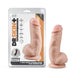 The Dr. Skin Girthy Short Thick Dildo - Vanilla, a realistic, flesh-toned dildo with a suction cup base, is shown beside its packaging highlighting its lifelike feel and strap-on harness compatibility.