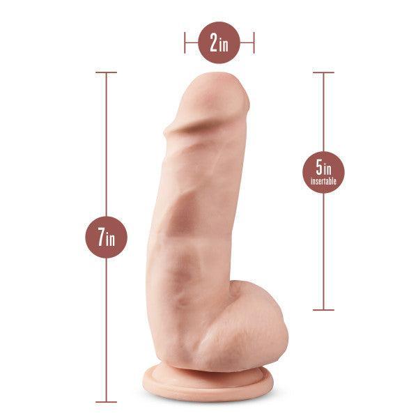 The Dr. Skin Girthy Short Thick Dildo - Vanilla offers a realistic experience with its pronounced head and veins, measures 7" long by 2" wide (5" insertable), features a sturdy suction cup base, and is compatible with strap-on harnesses.