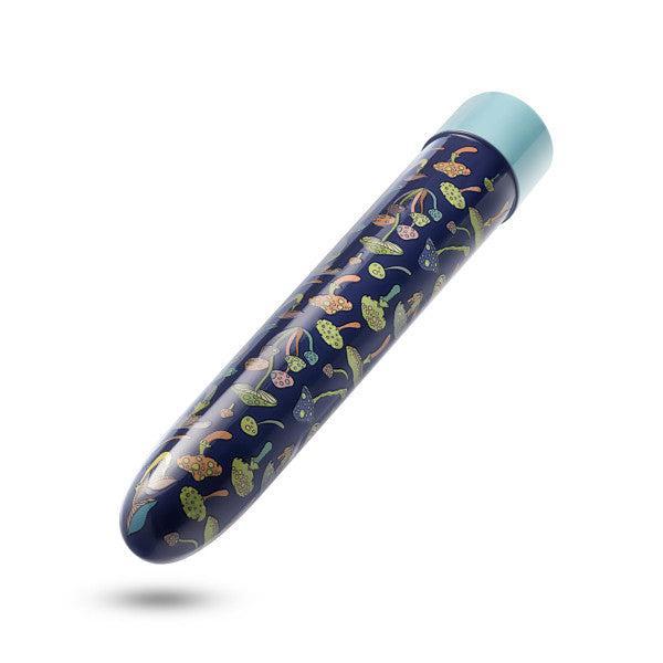 A dark blue, cylindrical object with a rounded tip and a light blue cap, adorned with colorful illustrations of various fruits and leaves, the Blush Dreamscape Powerful Extra Long Rechargeable Vibrator is isolated on a white background.