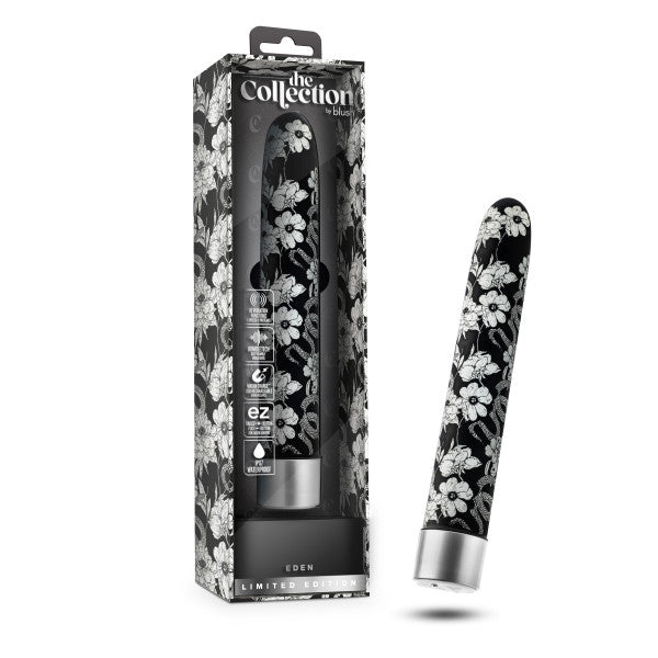 The Eden Black Floral Slim Beginner Bullet Vibrator by Blush is displayed both inside its clear packaging and outside. The box features branding from "Blush" and some product information. This black-and-white floral patterned vibrator has a sleek, cylindrical shape with a rounded tip and powerful vibration modes.