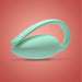 The Elvie Trainer Smart Kegel Exerciser, a mint green, modern, oval-shaped device with a curved handle and "elvie" on its side, is displayed against a red gradient background.