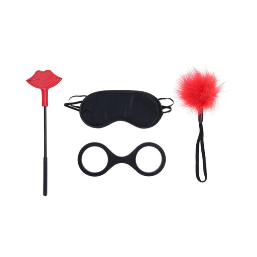 The Ex's & Oh's Kiss Kit - 4 Piece Beginner Bondage Kit includes a red lip-shaped paddle, black blindfold, black silicone double-ring, and red feather tickler, all displayed on a white background.