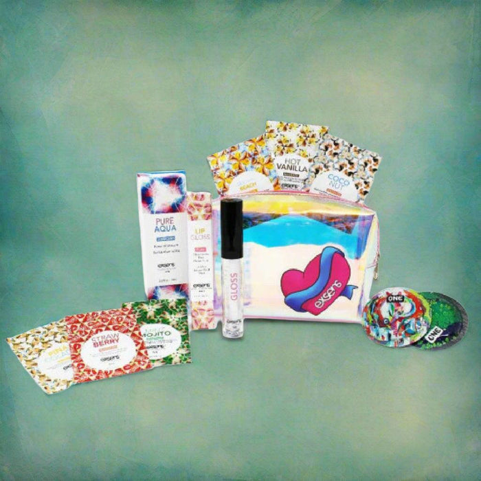 Exsens Escape Pleasure Kit contents showing flavoured massage oil, gloss, lube, condoms next to travel pouch 