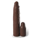 A Fantasy 9 Inch Silicone Penis Extension with a 3 inch Plug from Pipedream Products, in a rich chocolate color, stands vertically next to a shorter, similarly colored cylindrical object. Their texture and shape resemble that of chocolate figures. The taller object features an irregular surface design typical of a silicone sleeve.