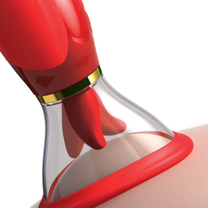 Close-up of a red-colored silicone breast pump attached to a breast. The pump has a transparent section where the nipple is visible inside. The device features a gold-colored band separating the red and clear sections, reminiscent of the elegance found in Pipedream Products' Fantasy For Her Ultimate Pleasure Double Ended Vibrator 24 K Gold Luxury Edition. The background is white.