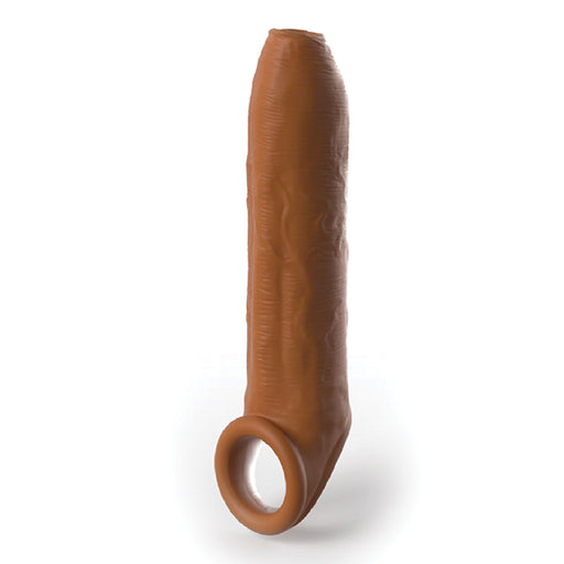 The Fantasy Uncut 7 Inch Silicone Penis Extension with Ball Strap in caramel, designed by Pipedream Products, is a realistic sleeve, featuring textured details and a hole at the base for wearing over the penis.