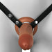 Close-up view of the Pipedream Products Fantasy X-Tensions Elite Hollow 8 Inch Silicone Dildo & Strap-On Harness - Chocolate, featuring a realistic silicone dildo attached to black webbed straps with metal rings and snaps. The harness is securely fastened to a mannequin, offering an effective erectile dysfunction solution.