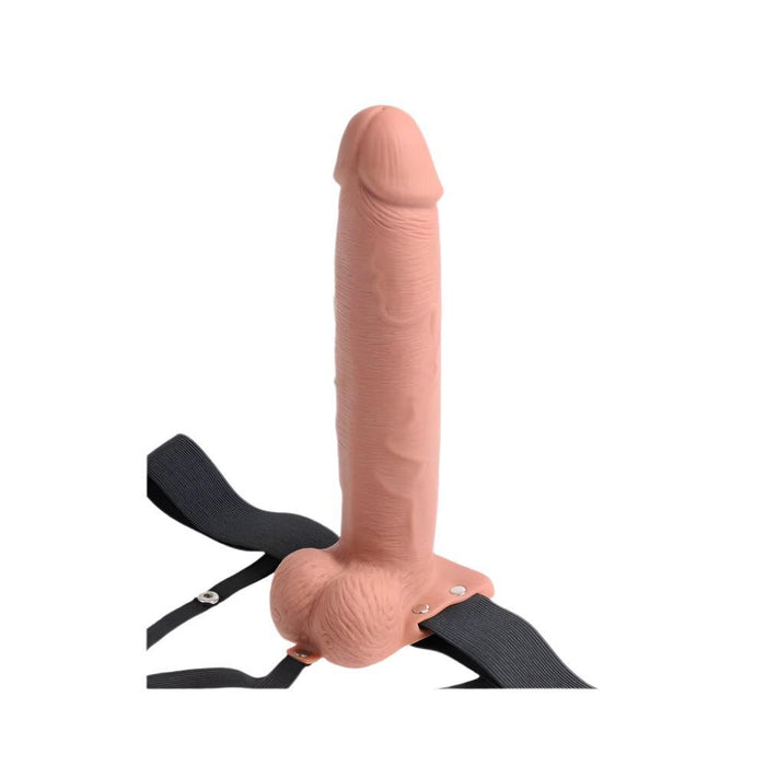 Introducing the Fetish Fantasy Vibrating 10 Inch Hollow Dildo & Strap-on Harness - Caramel by Pipedream Products. This realistic silicone dildo features lifelike textures and details, and it stands vertically on a flat surface with ease. The caramel-colored dildo is designed for secure attachment with its adjustable black straps, making it perfect for those dealing with erectile dysfunction or looking to explore strap-on play.