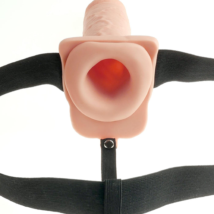 Close-up of the Fetish Fantasy Vibrating 11 Inch Hollow Dildo with Balls & Strap-on Harness in Vanilla, featuring a smooth finish and adjustable black elastic straps. The open-ended design provides versatility, all set against a white backdrop for clarity.