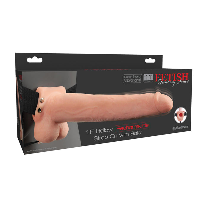 The Fetish Fantasy Vibrating 11 Inch Hollow Dildo with Balls & Strap-on Harness - Vanilla features a rechargeable design with super strong vibrations, an adjustable strap for a customized fit, and a flesh-colored finish for comfort and pleasure.
