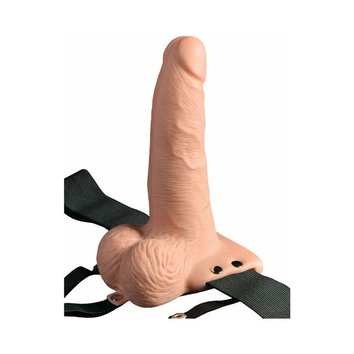 An image of the Pipedream Products Fetish Fantasy Vibrating 6 Inch Hollow Dildo with Balls & Strap-on Harness w/ Remote in vanilla, showcasing its flesh-toned, detailed texture and form. This strap-on sex toy comes with adjustable black straps and is ideal for those experiencing erectile dysfunction.