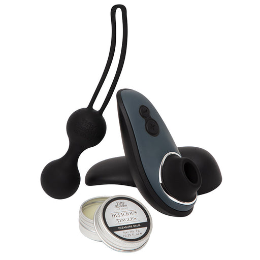 The Fifty Shades of Grey Desire Blooms Kit includes black silicone kegel balls, a sleek handheld vibrator for clitoral pleasure, and an open tin of "Delicious Thaces" balm—ideal for couples seeking to enhance intimate moments.
